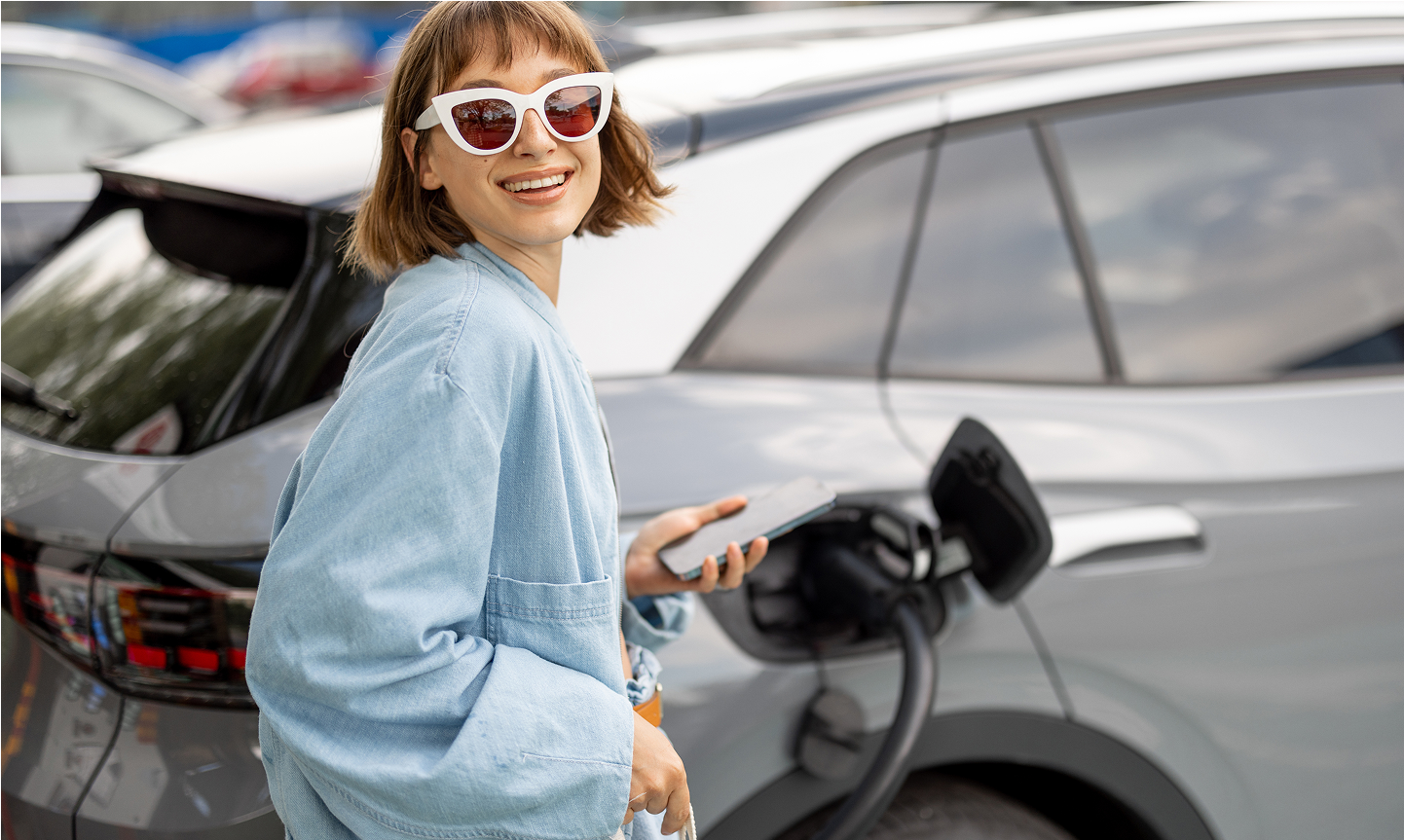 women fueling the car