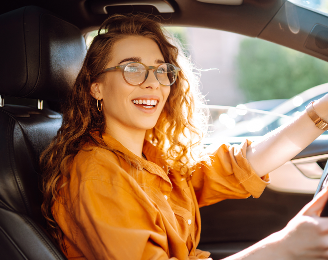 women happy driving car